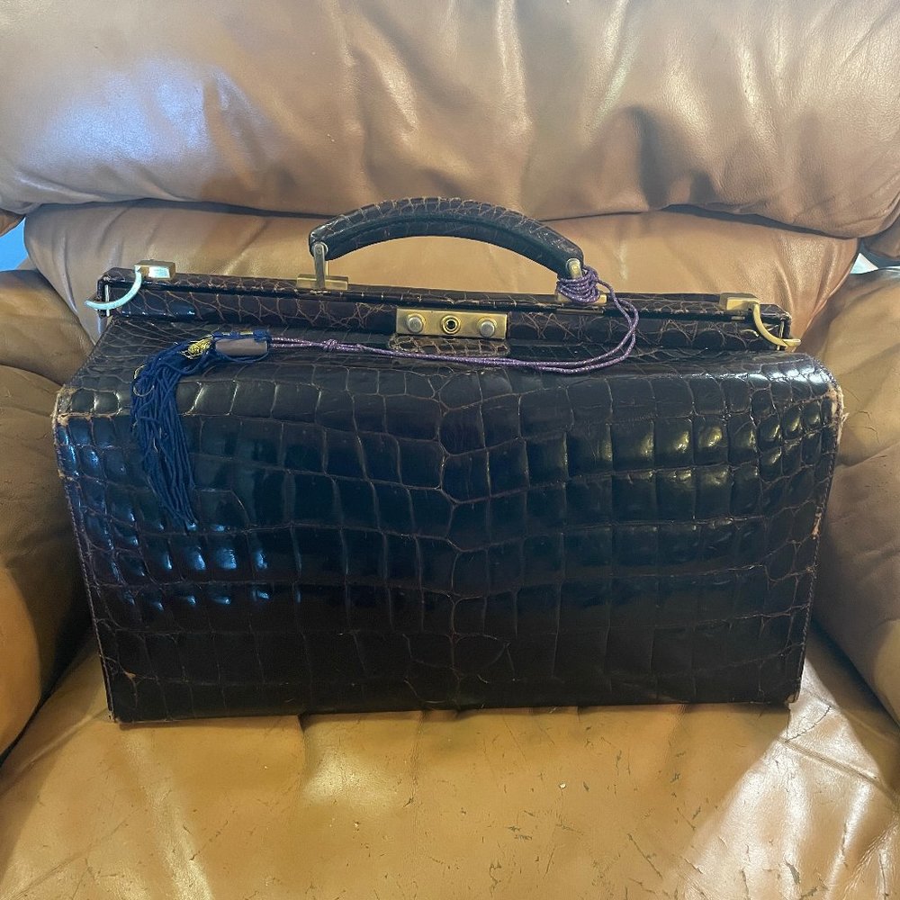 1984	Bijan	Dark Brown Crocodile Train Case with Lock and Keys